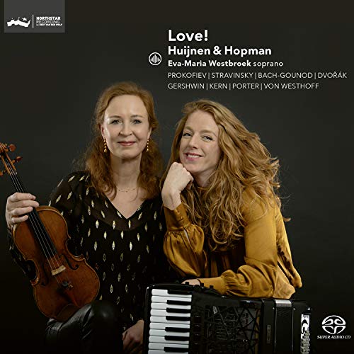 Album cover featuring two women, one with violin, one with keyboard, against dark background.