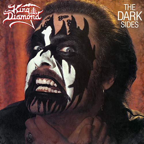 King Diamond album cover: man with dark face paint and long hair.