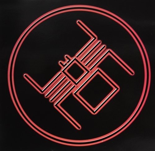 Red geometric symbol within a circle on a black background.