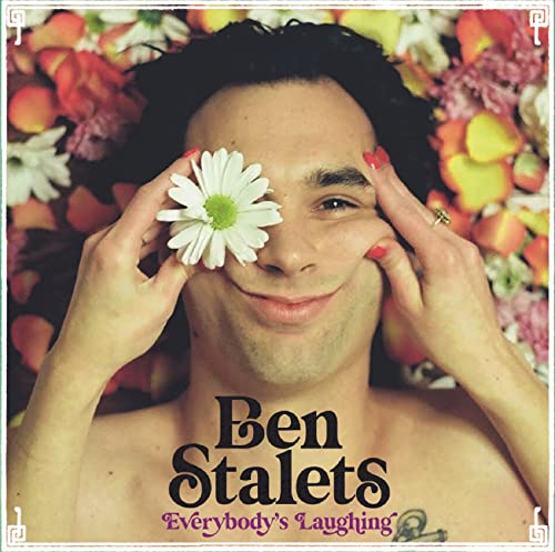 CD cover: Man with flower over eye, surrounded by colorful petals.