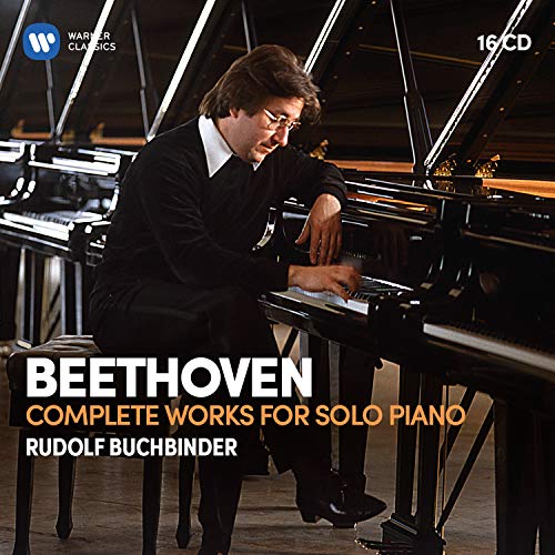 Man in black playing piano, Beethoven CD cover with white and orange text.