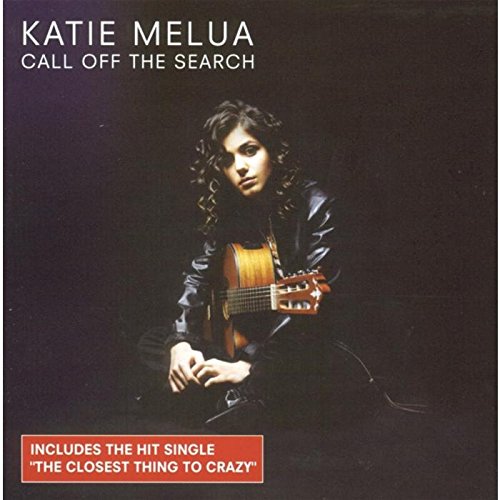 "CD cover featuring Katie Melua holding a guitar, dark background, with text overlays."