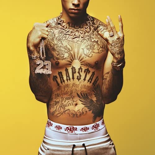 Central Cee album cover: tattooed chest, gold jewelry, yellow background.