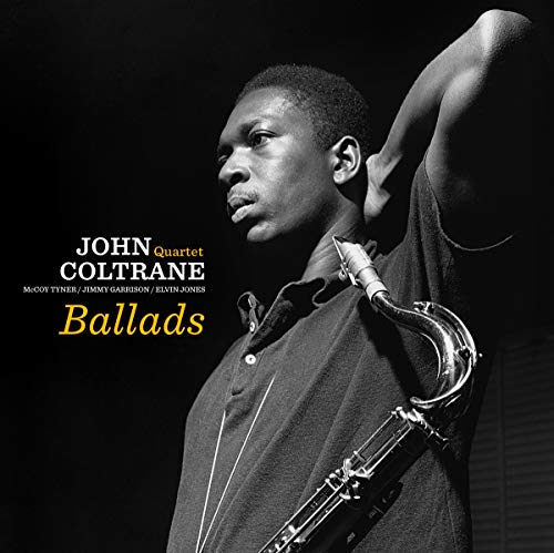 John Coltrane album cover, black and white portrait with saxophone.