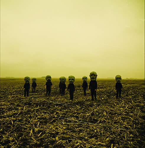 Slipknot album cover: figures with mask-like heads in a field.