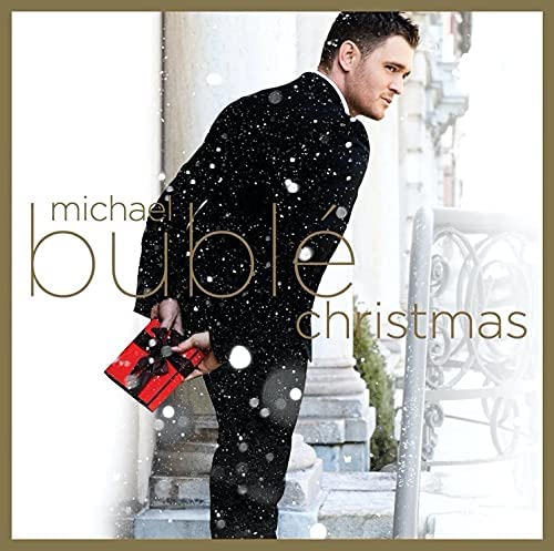 Michael Bublé “Christmas” CD cover with artist in a sparkly suit.