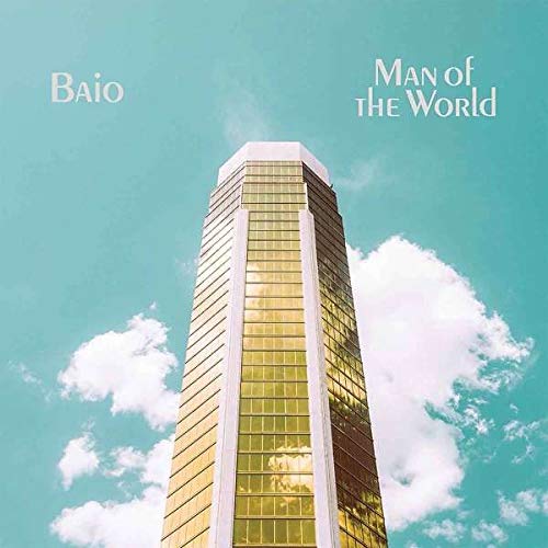 Album cover featuring a tall, gold skyscraper against a blue sky with white clouds.
