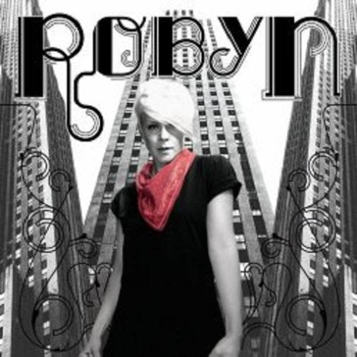 CD cover for Robyn’s album, featuring the artist in front of skyscrapers.