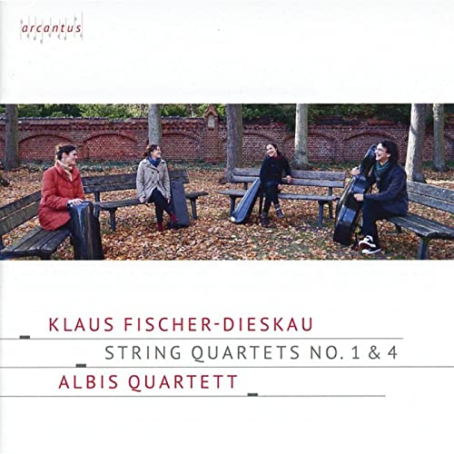 Four musicians with instrument cases sitting on benches in a park with autumn leaves.
