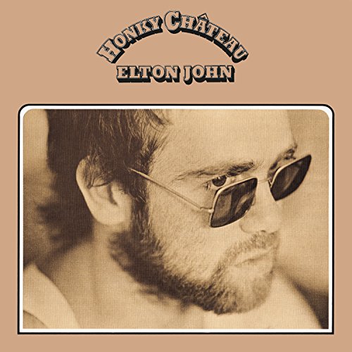 "Elton John's 'Honky Château' vinyl album cover featuring a black and white photo of Elton John."