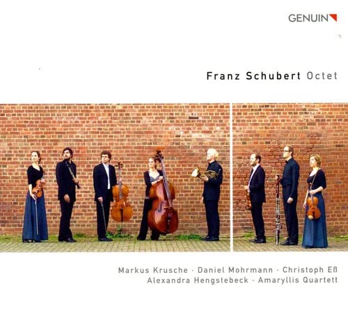 CD cover featuring six musicians standing before a brick wall.