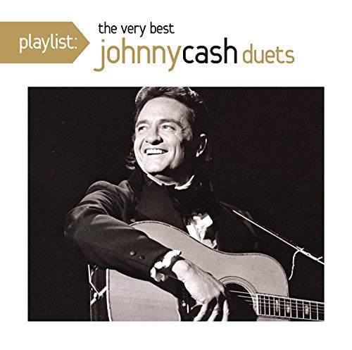 Johnny Cash smiling while playing an acoustic guitar on a music album cover.