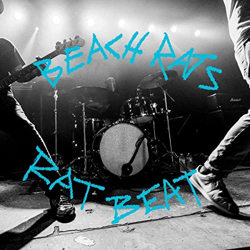 Black and white stage photo with blue text: "Beach Rats - Rat Beat".