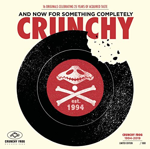 A vinyl record cover featuring a black vinyl with a red label and dinosaur skull.