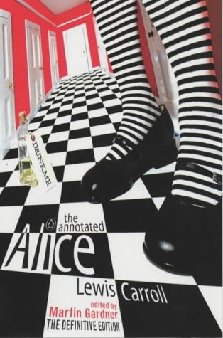 "Book cover of 'The Annotated Alice' featuring a striped leg on a checkerboard floor."