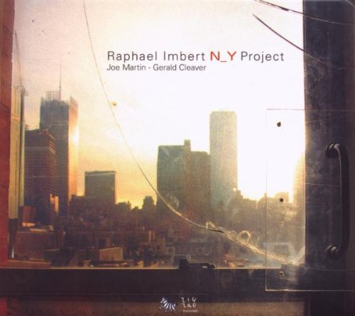 "Album cover with a broken window showing a cityscape at sunset."