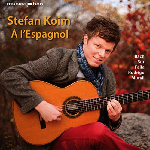 Album cover featuring a man playing a guitar, seated outdoors with autumn foliage.