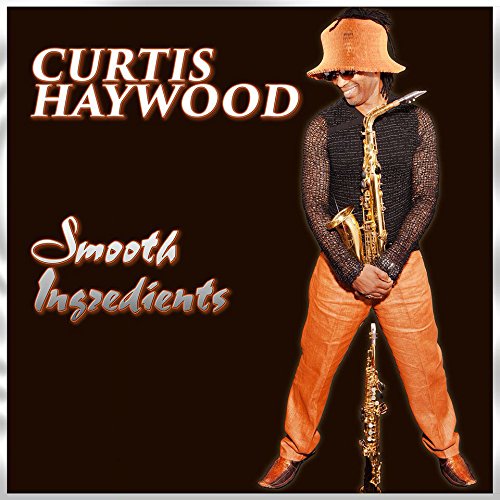 Man in orange hat and pants holding a saxophone on a black album cover.
