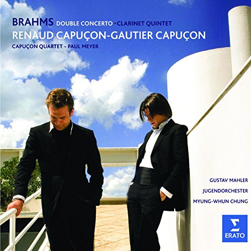 CD cover featuring two men in black suits against a blue sky with clouds.