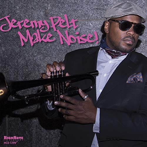 Album cover featuring a man holding a trumpet, wearing a suit and sunglasses.