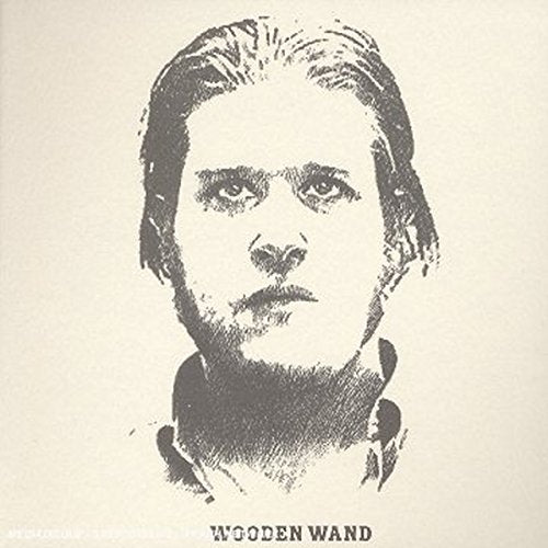 Black and white portrait of a man with "Wooden Wand" text below.