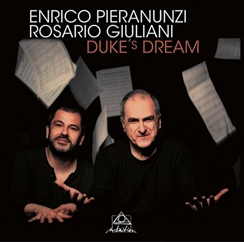 "Jazz album cover featuring two men surrounded by floating sheet music against a black background."