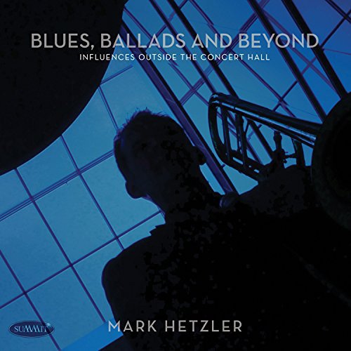 "CD cover with a silhouette of a man playing a trumpet, blue-toned background."