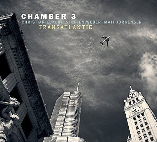 "Album cover featuring a black-and-white cityscape with a plane flying between skyscrapers."