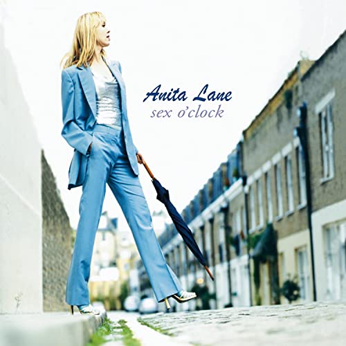 CD cover: Anita Lane in a blue suit, holding an umbrella.