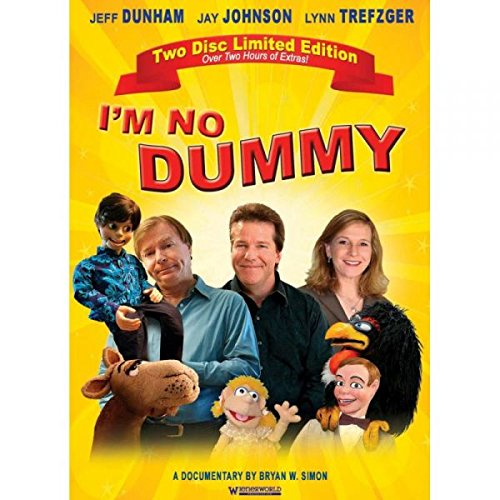 DVD cover with three people and four ventriloquist dummies, yellow background, red title text.