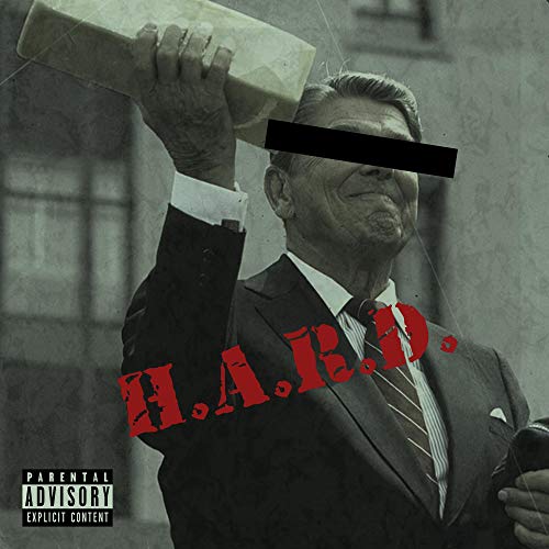 A vinyl record cover featuring a man in a suit holding a brick.