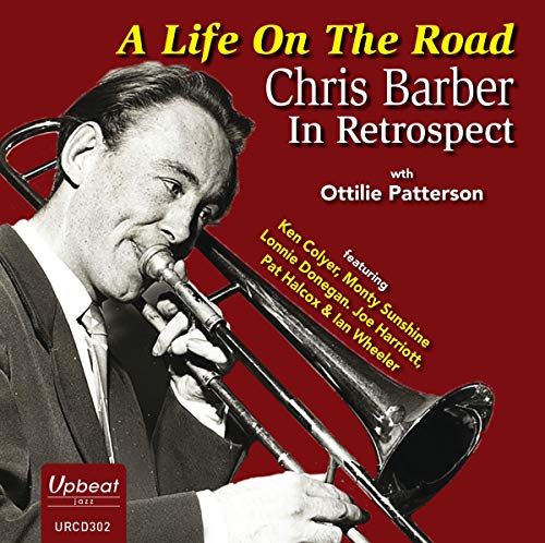 Red album cover with black-and-white image of man playing trombone.
