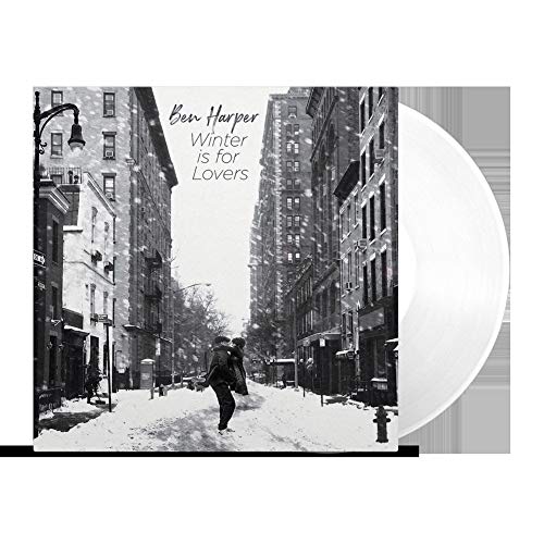 "Album cover: black and white city street scene with person walking in snow."
