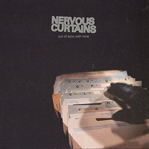 "Vinyl album cover with 'Nervous Curtains' title and stacked filing cabinets."