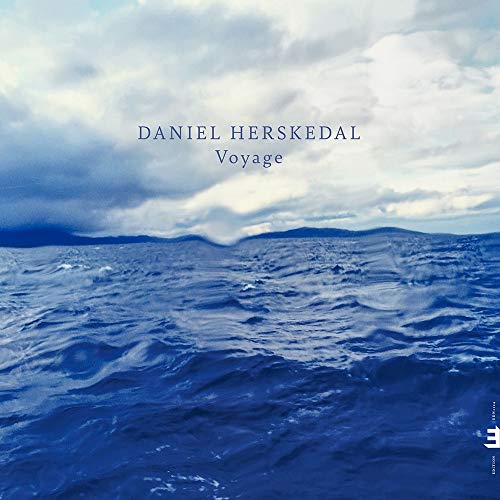 "Album cover with choppy blue water and cloudy sky, featuring 'DANIEL HERSKEDAL Voyage' text."
