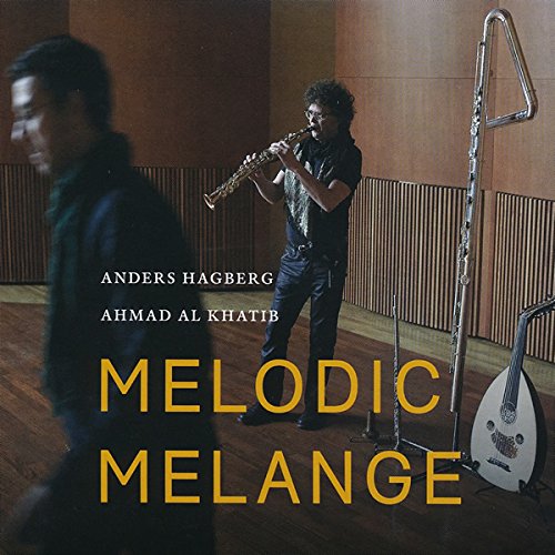 "Music album cover featuring a man playing saxophone with another man in the foreground."