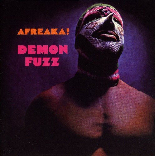Album cover with a man wearing a colorful knit mask, text "AFREAKA!" and "DEMON FUZZ".
