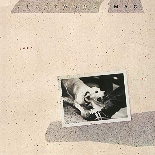 "Album cover with a black-and-white photo of an elephant on a beige background."