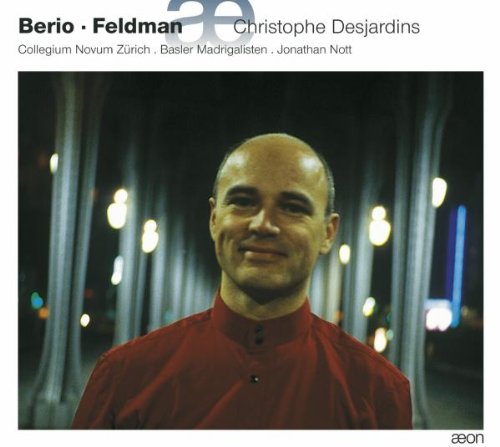 "Album cover featuring a man in a red shirt, blurred lights in the background."