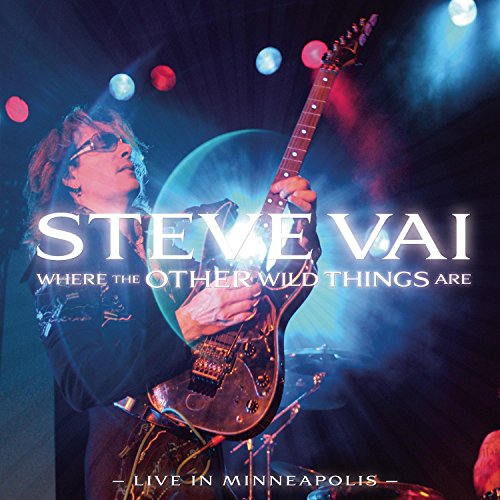 "Steve Vai playing guitar on stage, surrounded by stage lights, on a CD cover."