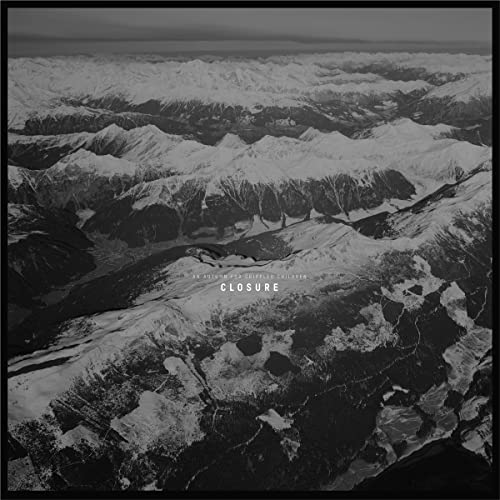 Black and white aerial view of snow-covered mountains with text in the center.