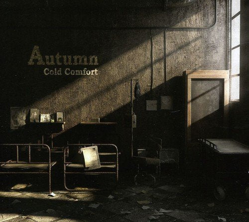 "Album cover for 'Autumn - Cold Comfort' showing a dimly lit, abandoned room with metal beds."