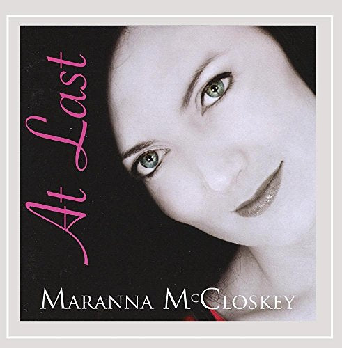 Album cover featuring a black-and-white portrait of Maranna McCloskey with pink text "At Last".