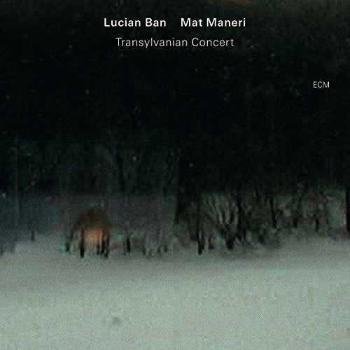 A snowy forest scene with a horse, album cover for "Transylvanian Concert" jazz CD.