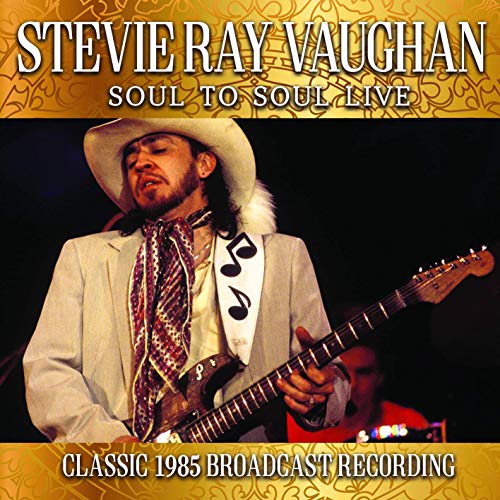 Stevie Ray Vaughan playing a red electric guitar on album cover.