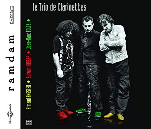 CD cover featuring three men with clarinets, dark background.