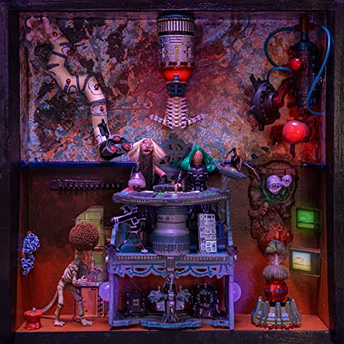 Diorama with miniature figures of musicians and strange robotic elements.