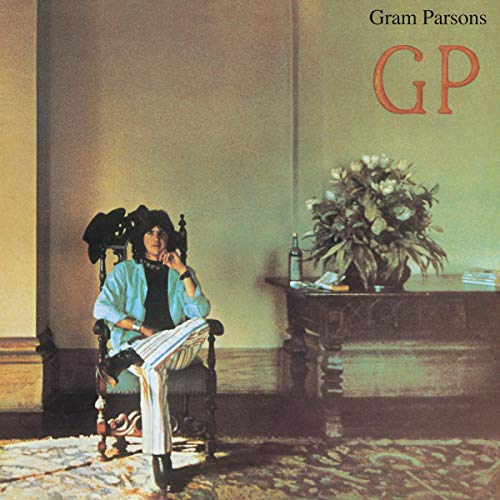Album cover featuring a man sitting in a chair, reading a book.