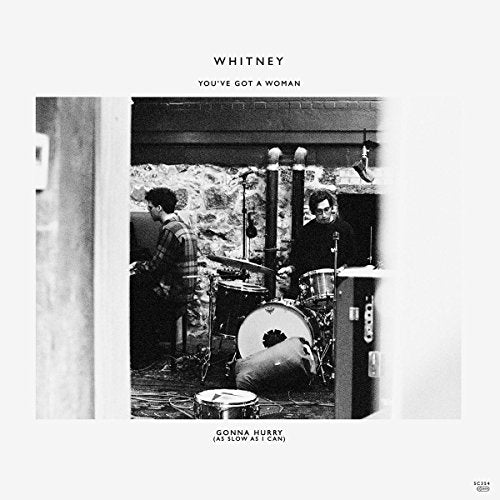 Black and white album cover featuring two musicians with a drum kit.