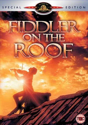 "Fiddler On The Roof" DVD cover featuring a man playing violin on a roof.